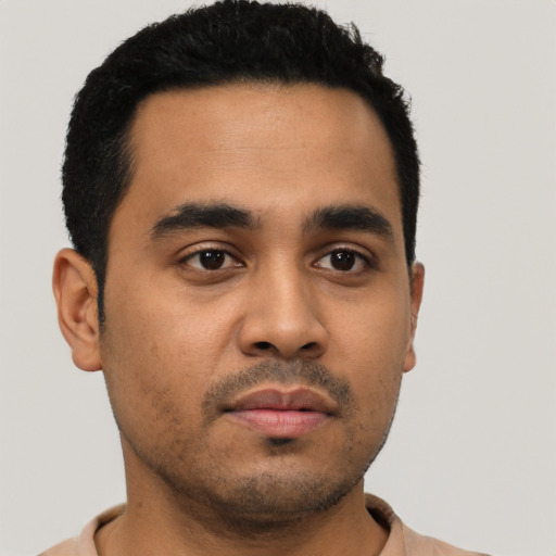 Neutral latino young-adult male with short  black hair and brown eyes