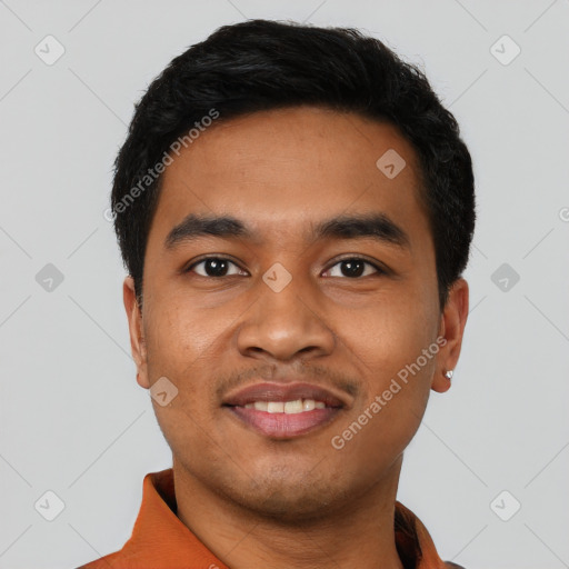 Joyful latino young-adult male with short  black hair and brown eyes