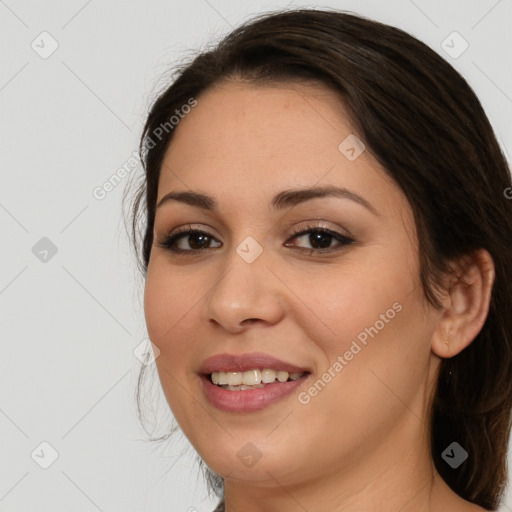 Joyful white young-adult female with long  brown hair and brown eyes