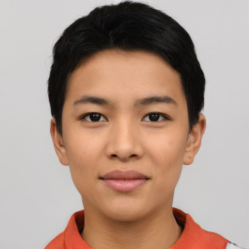 Joyful asian young-adult female with short  black hair and brown eyes