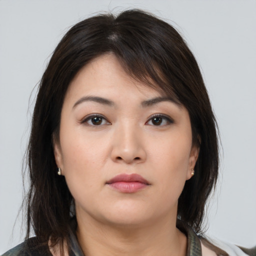 Neutral asian young-adult female with medium  brown hair and brown eyes