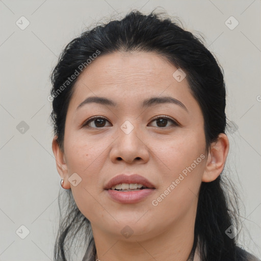 Joyful asian young-adult female with medium  black hair and brown eyes