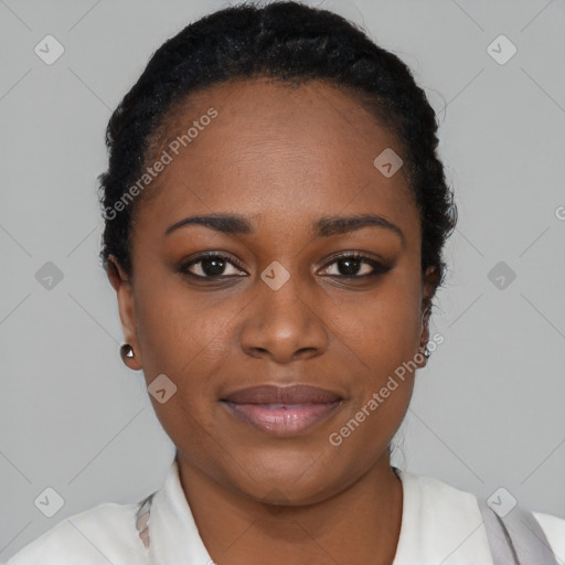 Joyful black young-adult female with short  black hair and brown eyes