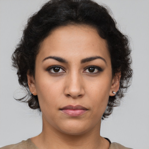 Neutral latino young-adult female with short  brown hair and brown eyes
