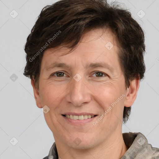 Joyful white adult male with short  brown hair and grey eyes