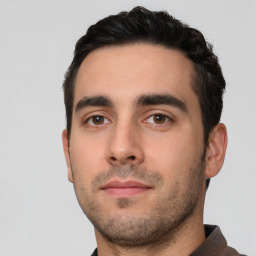 Neutral white young-adult male with short  black hair and brown eyes