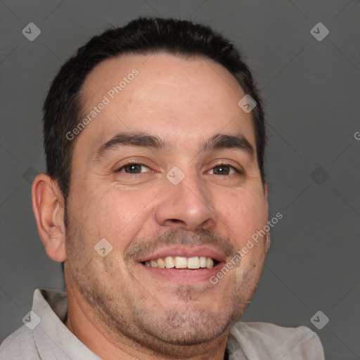 Joyful white adult male with short  brown hair and brown eyes