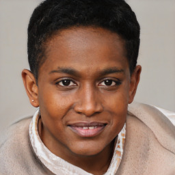 Joyful black young-adult male with short  brown hair and brown eyes