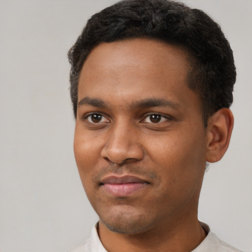 Neutral black young-adult male with short  black hair and brown eyes