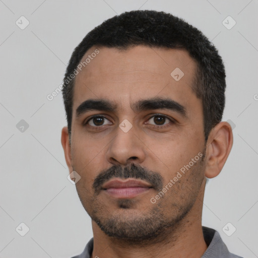 Neutral latino young-adult male with short  black hair and brown eyes