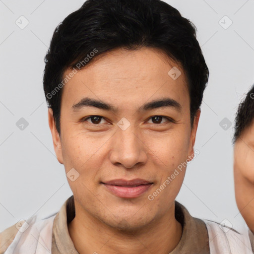 Joyful asian young-adult male with short  black hair and brown eyes