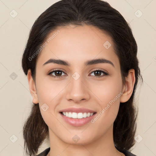 Joyful white young-adult female with medium  brown hair and brown eyes