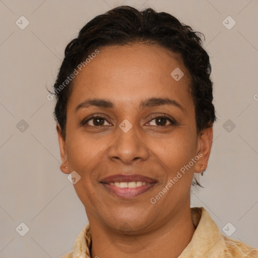 Joyful latino adult female with short  brown hair and brown eyes