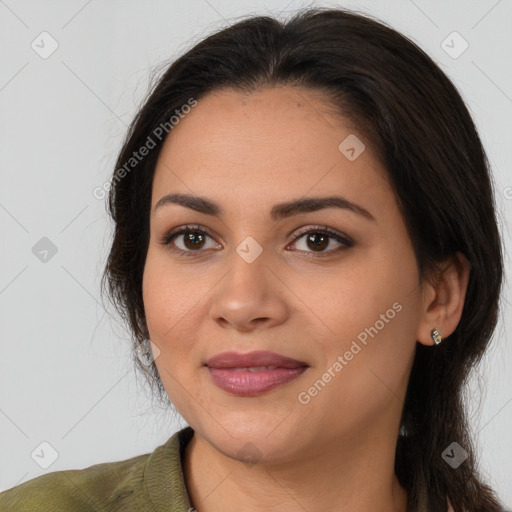 Joyful latino young-adult female with medium  brown hair and brown eyes