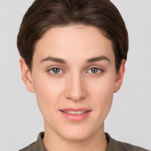 Joyful white young-adult female with short  brown hair and brown eyes