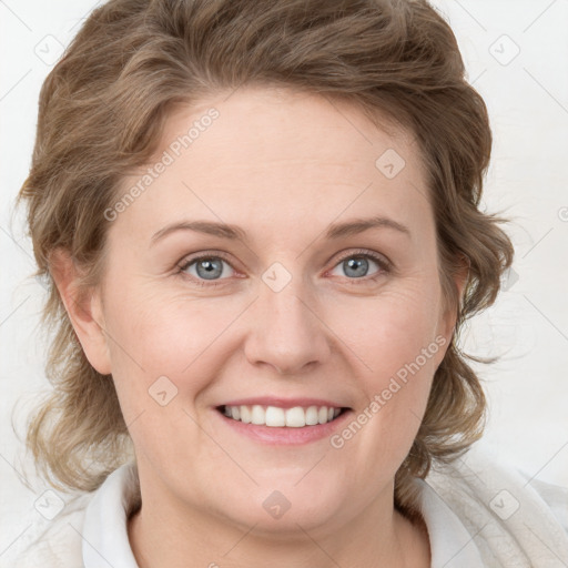 Joyful white young-adult female with medium  brown hair and blue eyes