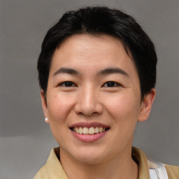 Joyful asian young-adult female with short  brown hair and brown eyes