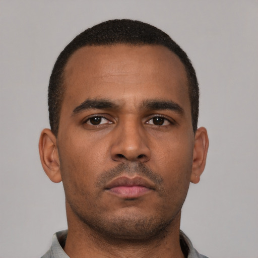 Neutral latino young-adult male with short  brown hair and brown eyes
