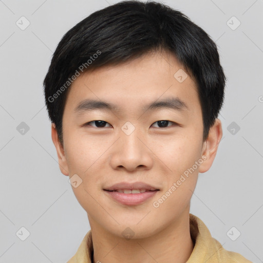 Joyful asian young-adult male with short  black hair and brown eyes