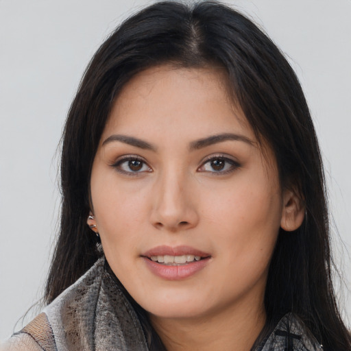 Joyful asian young-adult female with long  brown hair and brown eyes