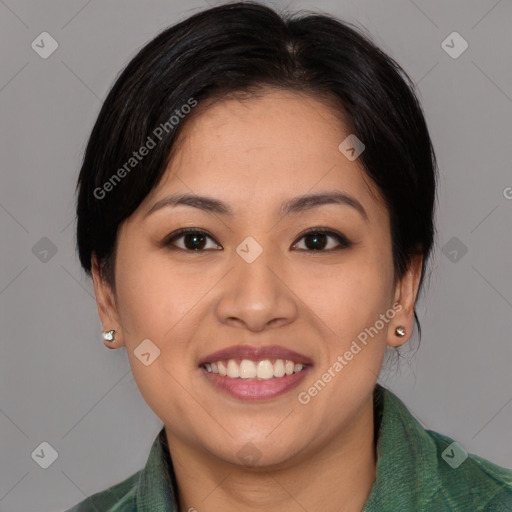 Joyful asian young-adult female with medium  brown hair and brown eyes