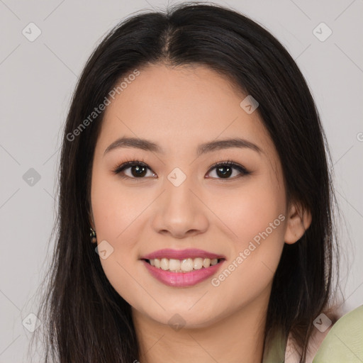 Joyful asian young-adult female with long  brown hair and brown eyes