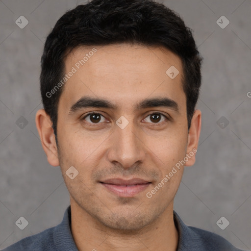 Joyful white young-adult male with short  black hair and brown eyes