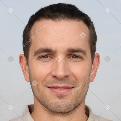 Joyful white young-adult male with short  brown hair and brown eyes