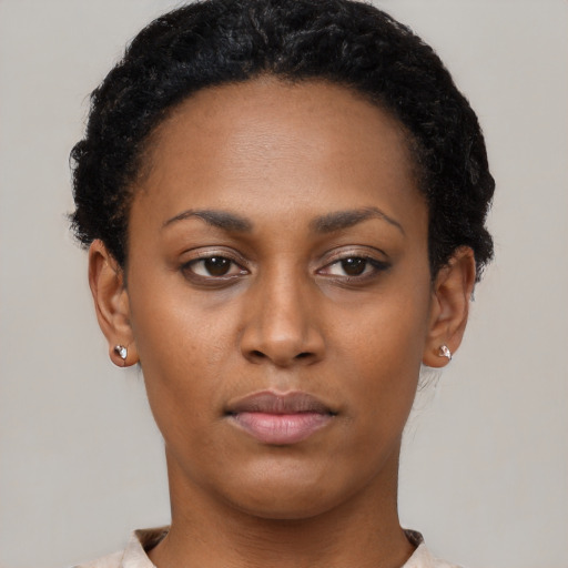 Neutral black young-adult female with short  black hair and brown eyes