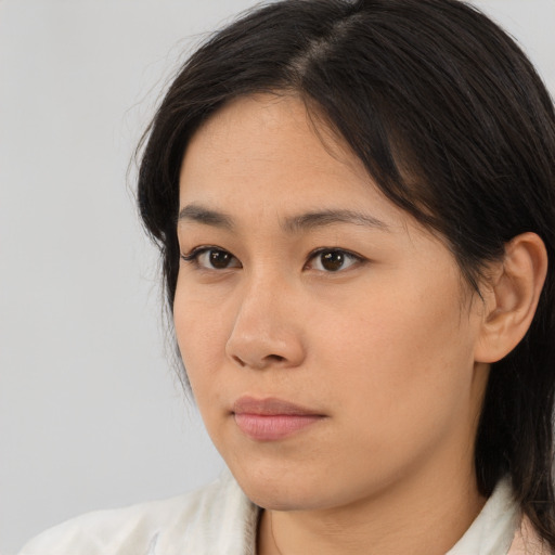 Neutral asian young-adult female with medium  black hair and brown eyes
