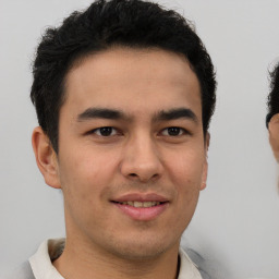 Joyful latino young-adult male with short  brown hair and brown eyes