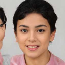 Joyful asian young-adult female with medium  black hair and brown eyes