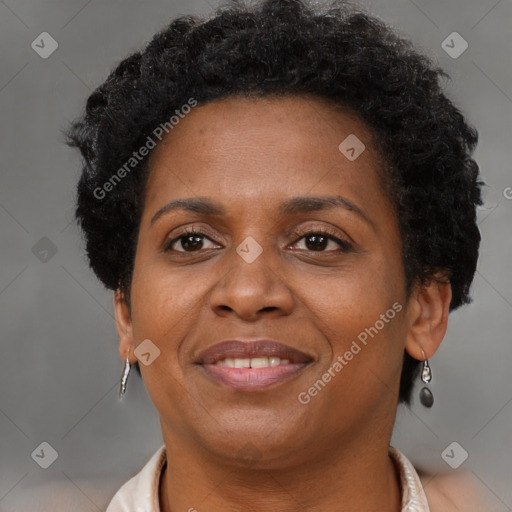 Joyful black adult female with short  brown hair and brown eyes