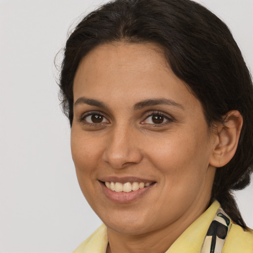 Joyful white adult female with medium  brown hair and brown eyes