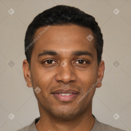 Joyful black young-adult male with short  black hair and brown eyes