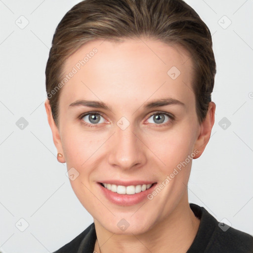 Joyful white young-adult female with short  brown hair and grey eyes