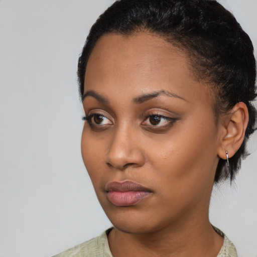 Neutral black young-adult female with short  black hair and brown eyes