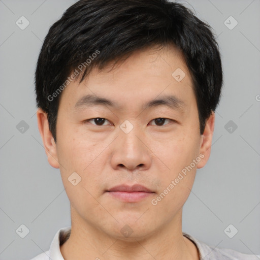 Neutral asian young-adult male with short  black hair and brown eyes