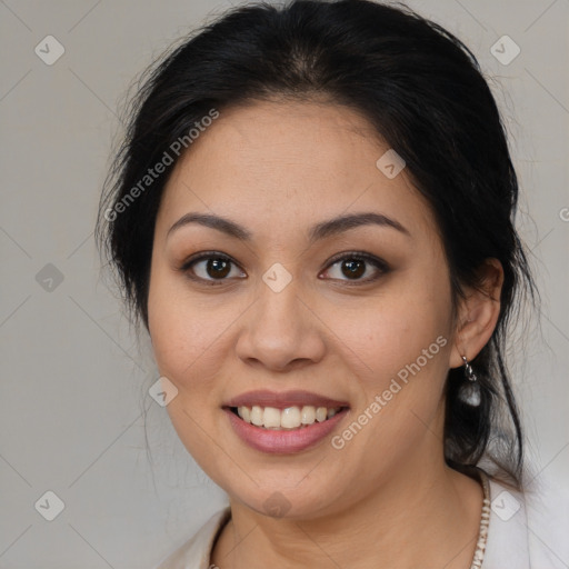 Joyful latino young-adult female with medium  brown hair and brown eyes