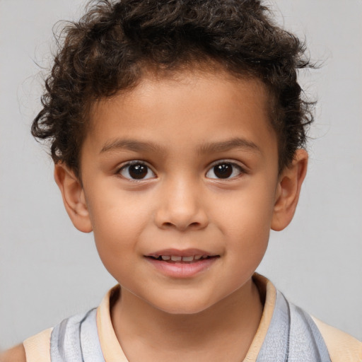 Joyful white child male with short  brown hair and brown eyes