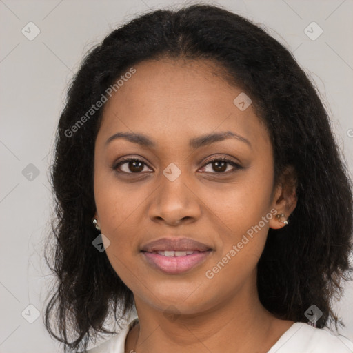 Joyful black young-adult female with long  brown hair and brown eyes