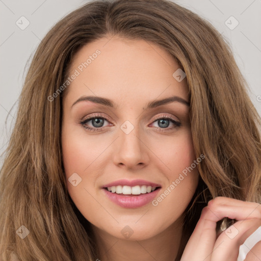 Joyful white young-adult female with long  brown hair and green eyes