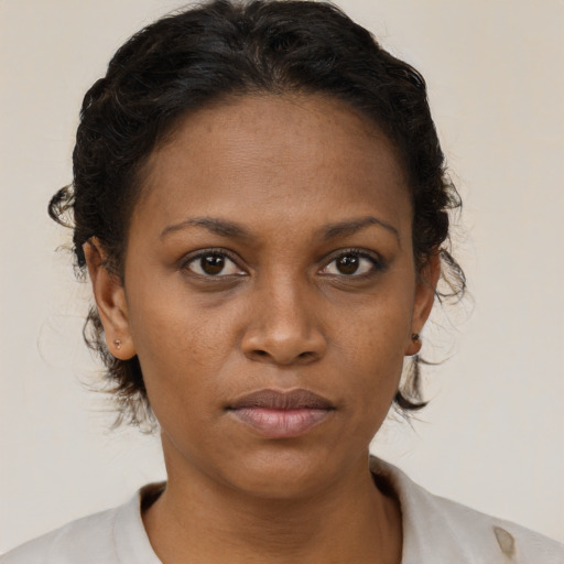 Neutral black young-adult female with short  brown hair and brown eyes