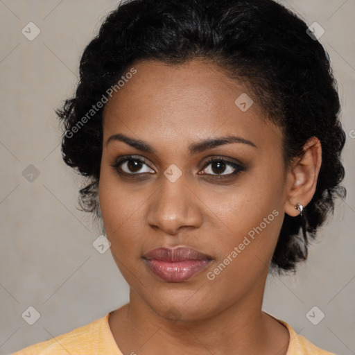 Joyful black young-adult female with short  brown hair and brown eyes