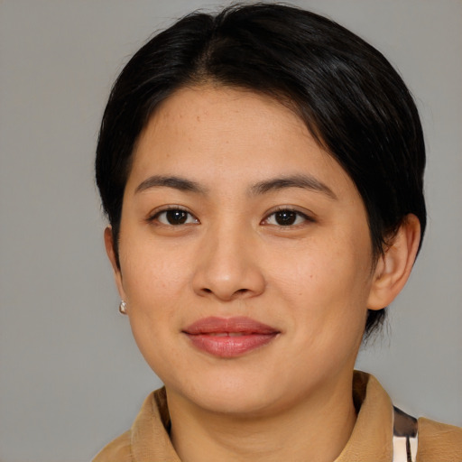 Joyful asian young-adult female with medium  brown hair and brown eyes