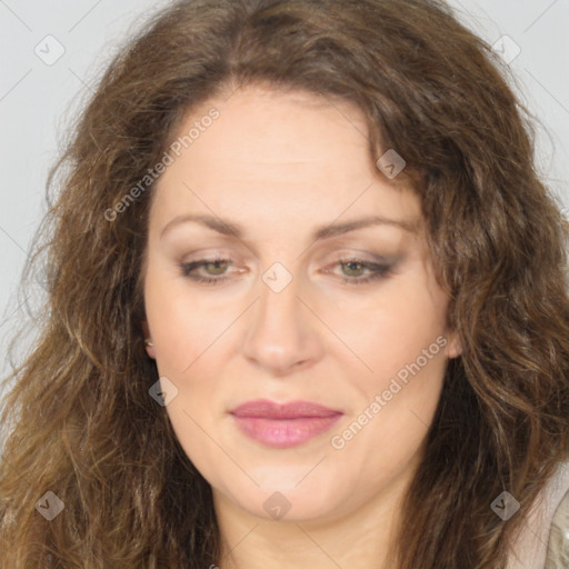 Joyful white adult female with long  brown hair and brown eyes