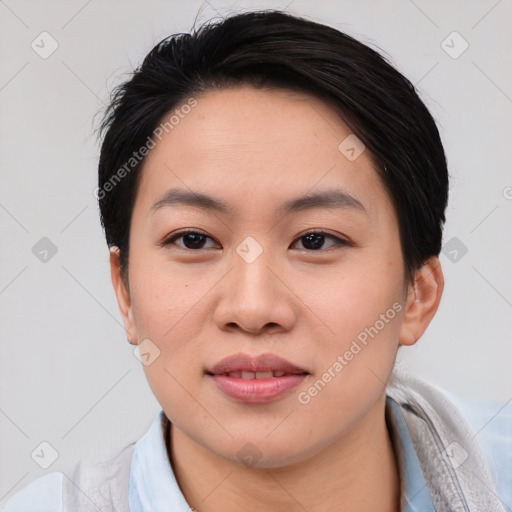 Joyful asian young-adult female with short  brown hair and brown eyes