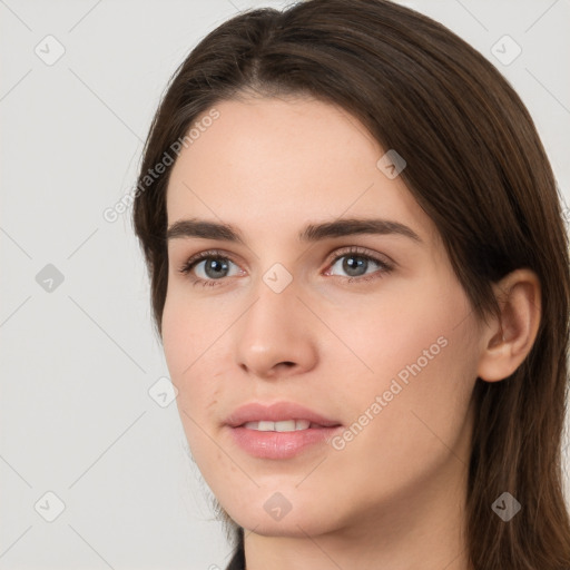 Neutral white young-adult female with long  brown hair and brown eyes