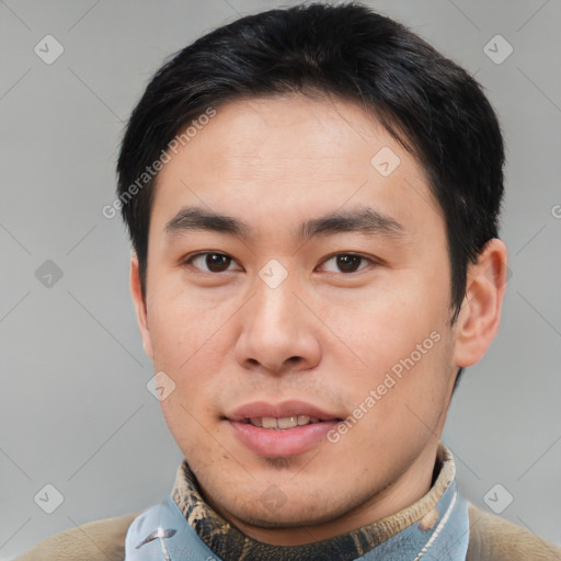 Joyful asian young-adult male with short  brown hair and brown eyes