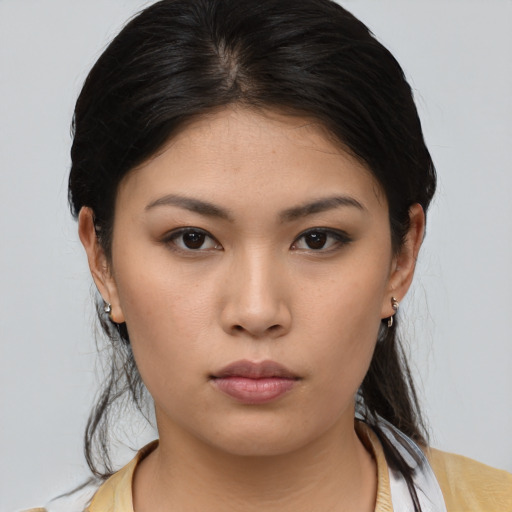 Neutral asian young-adult female with medium  brown hair and brown eyes